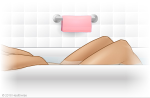 Person in a warm bath (sitz bath)