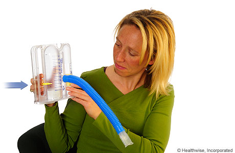A person moving the slider on a spirometer.