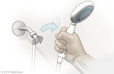 Hand-held shower head.