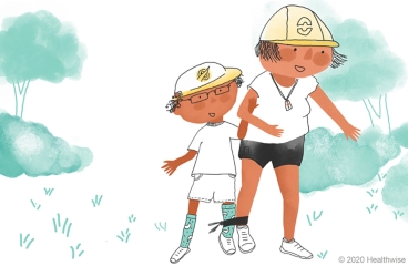 Arthur and his camp leader run a three-legged race.