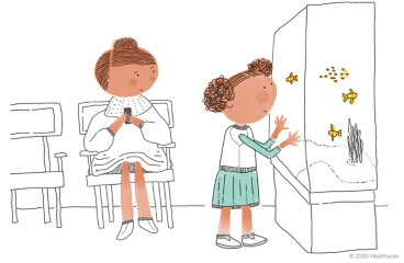 Darby mira la pecera en la sala de espera.