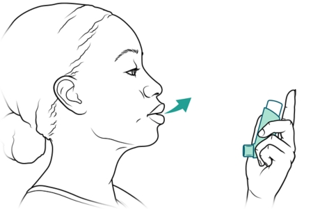 Person holding inhaler and exhaling.